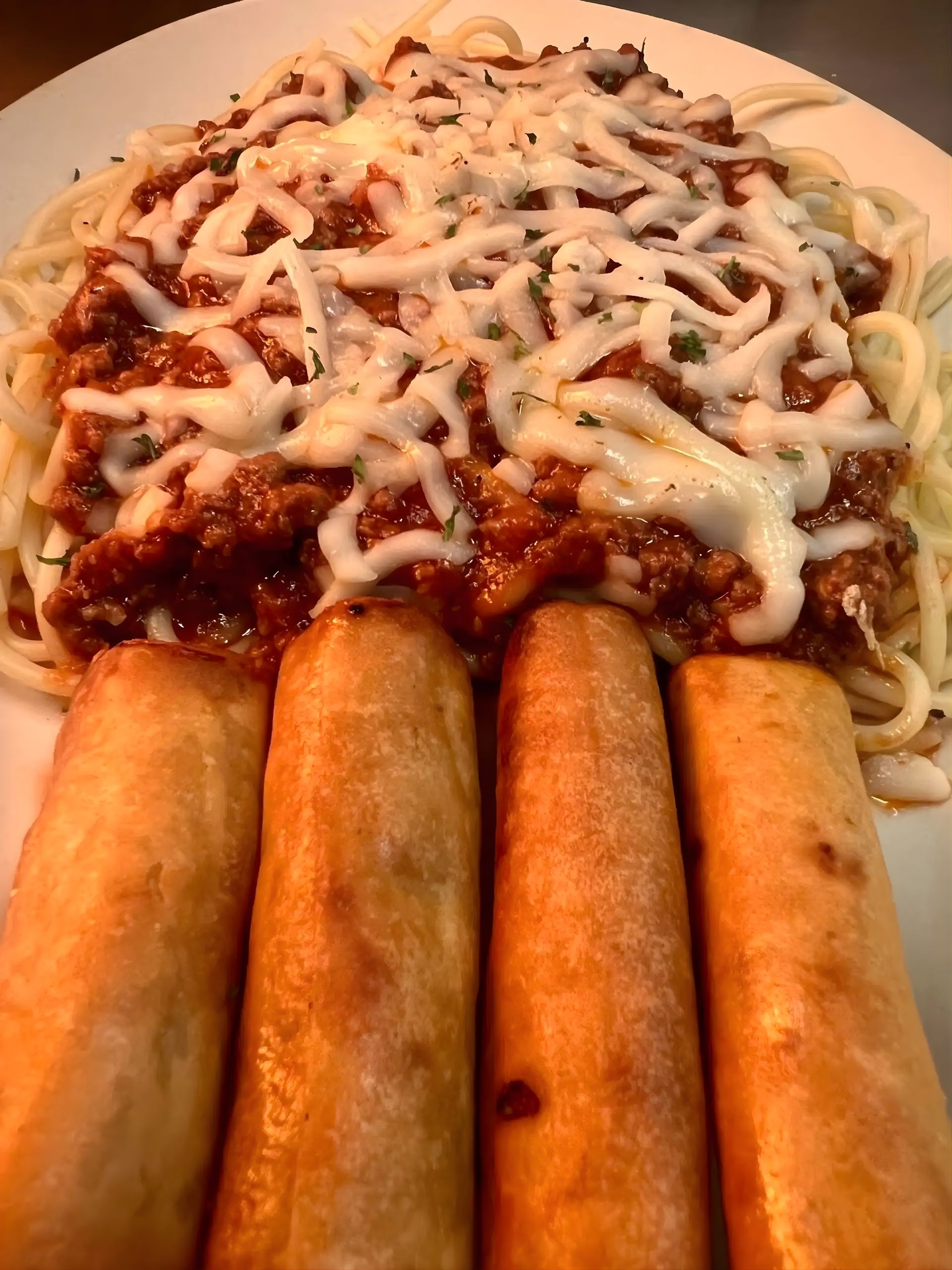 Beef Spaghetti and Spring Rolls at Archie's Grill - Filipino-style sweet spaghetti paired with crispy spring rolls